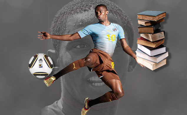 a man kicking a football with books on his side